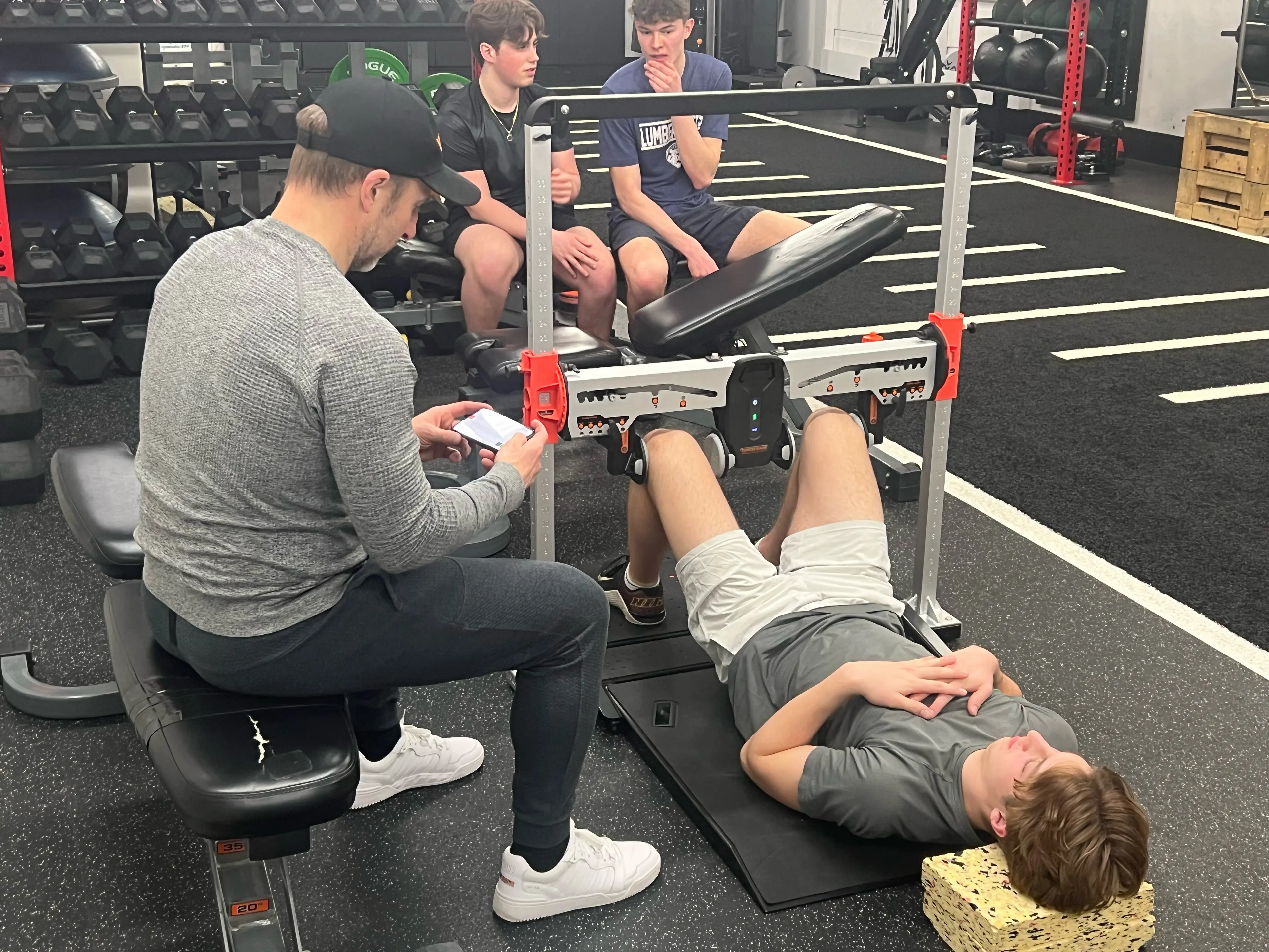 An Outside Edge athlete testing their hip ABD and ADD strength with ForceFrame